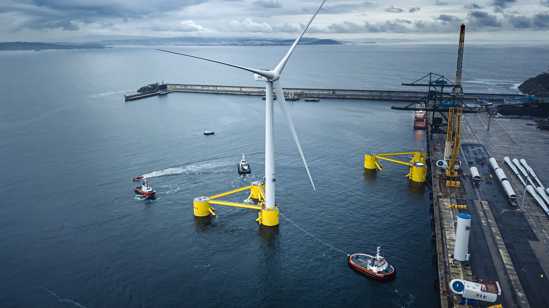 Floating offshore wind turbine at a port